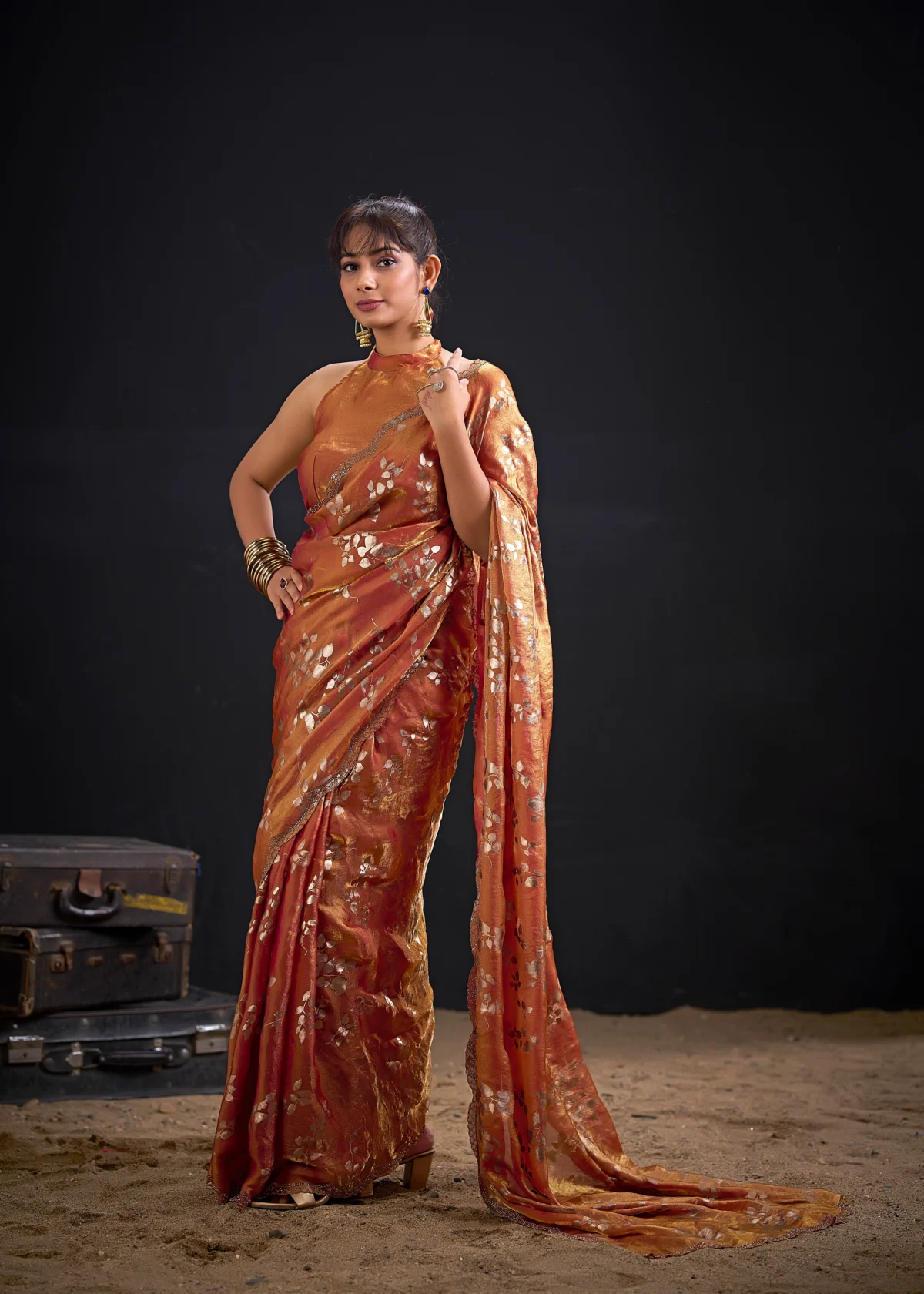 Noorva Shimmer Georgette Foil Print Saree with Swarovski embellished border and matching unstitched blouse.