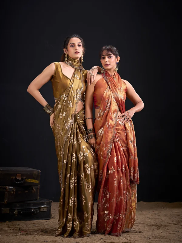 Noorva Shimmer Georgette Foil Print Saree with Swarovski embellished border and matching unstitched blouse.