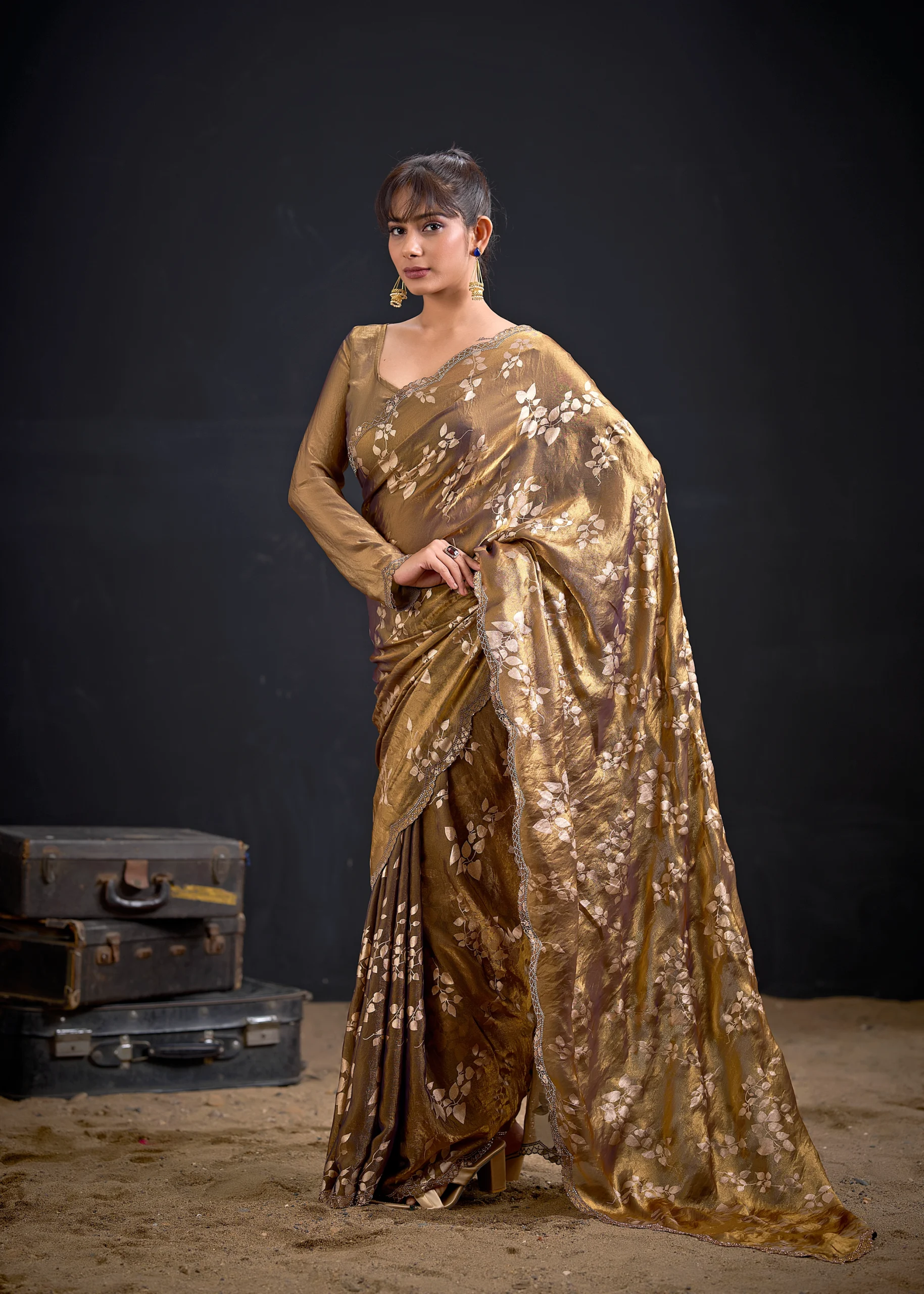Noorva Shimmer Georgette Foil Print Saree with Swarovski embellished border and matching unstitched blouse.