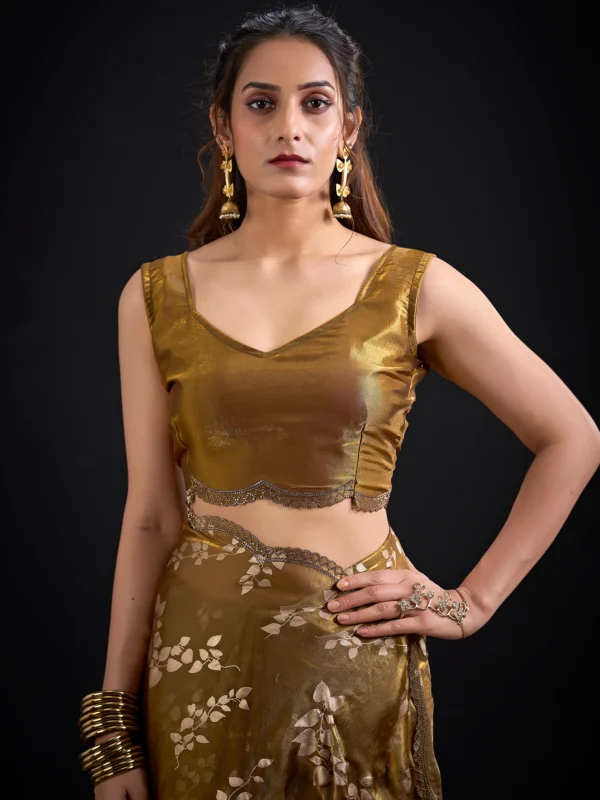Noorva Shimmer Georgette Foil Print Saree with Swarovski embellished border and matching unstitched blouse.