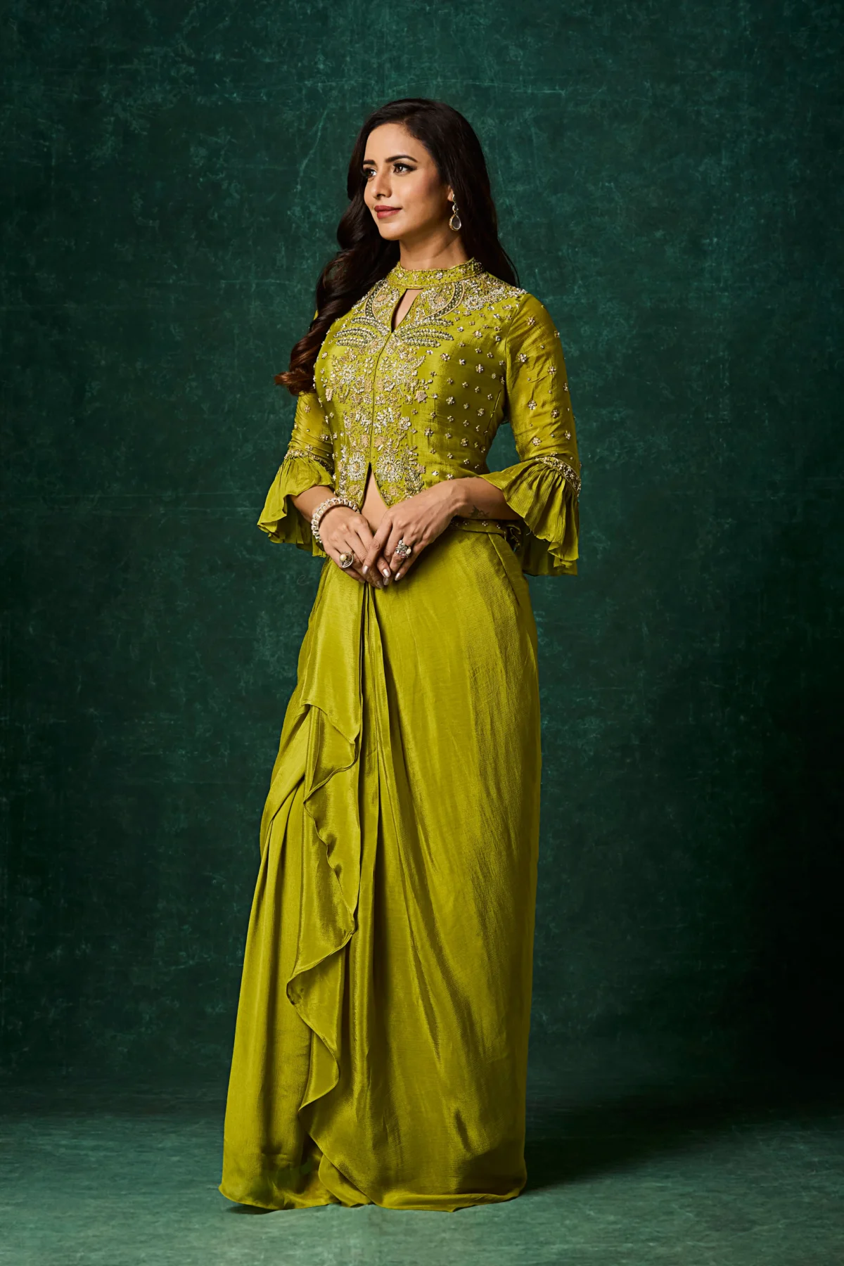 Designer Mehndi Green Indo Western drape skirt set with embroidered peplum top for weddings and festive occasions
