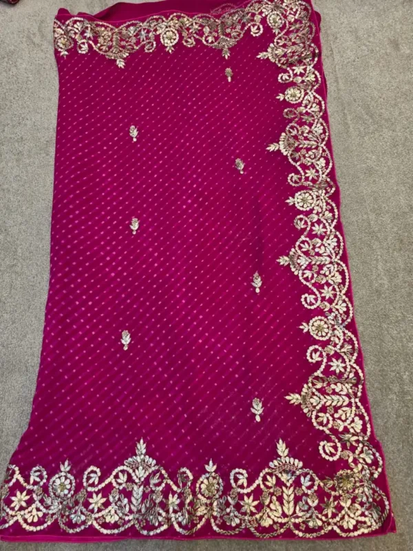 Rani Pink Pure Georgette Lehariya Saree with handcrafted Silver Gota Patti embroidery and designer floral border.
