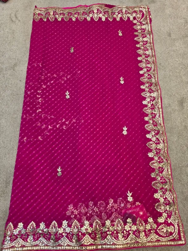 Noor-e-Rajputana Rani Pink Pure Georgette Lehariya Saree with handcrafted Silver Gota Patti work and designer embroidered border.
