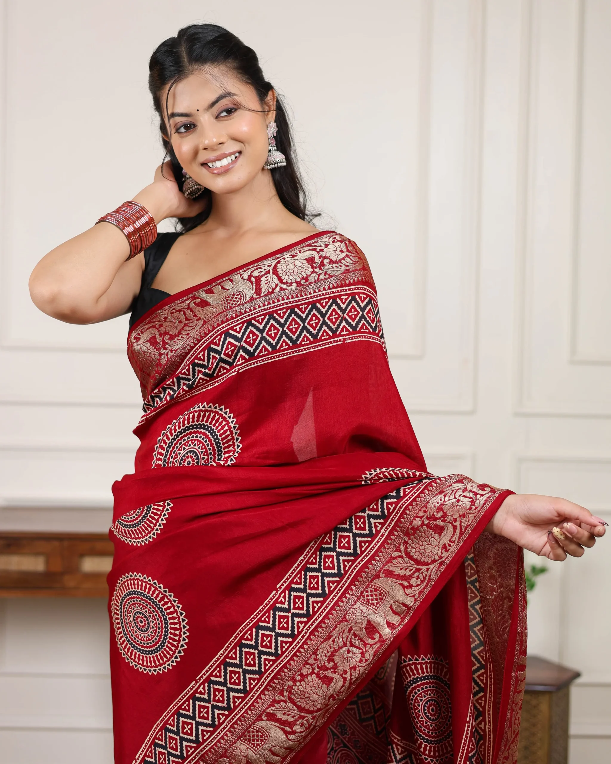 Royal Heritage mehroon modal silk Ajrakh saree featuring traditional Ajrakh print with rich zari pallu