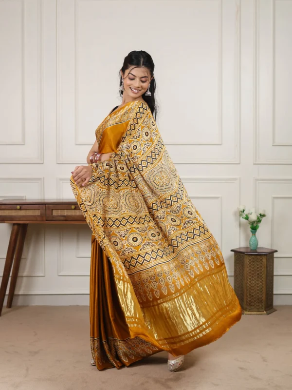 Heritage Ajrakh satin silk saree with traditional Ajrakh print and solid zari pallu featuring matching unstitched blouse